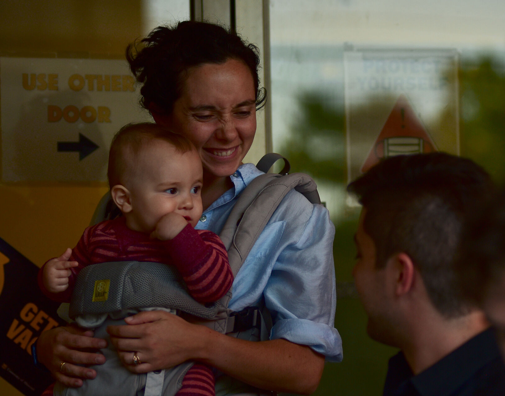 Racy Guinan holds her baby Rory as she greets her husband Andrew Guinan
